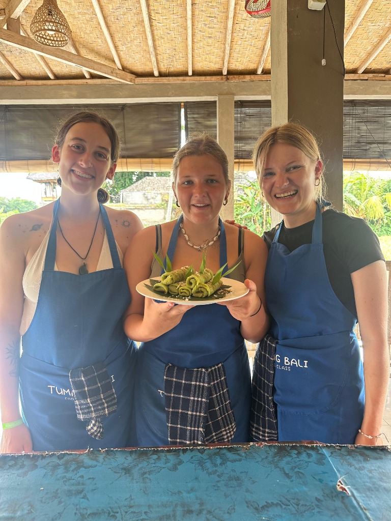 Happy guests with homemade Balinese dishes