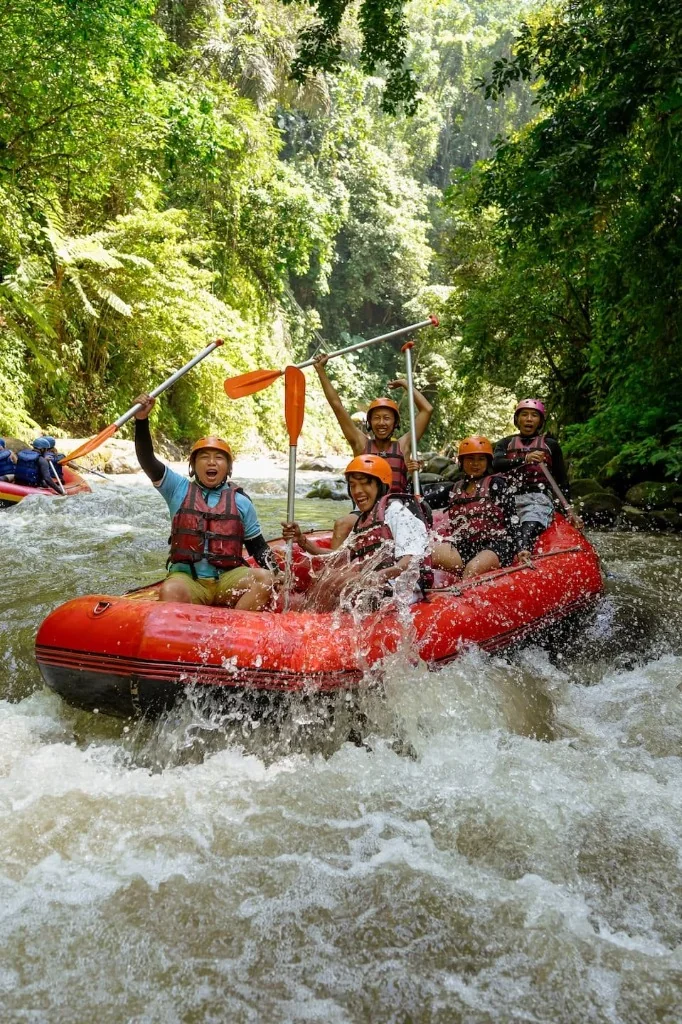 Ayung River whitewater rafting team celebrating on the river in Ubud Bali