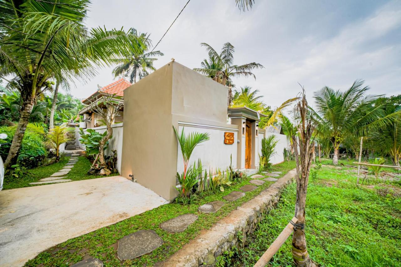 Serene Balinese Garden Border with Stone Accents - Uma Sari Bedulu Luxury Villas Ubud